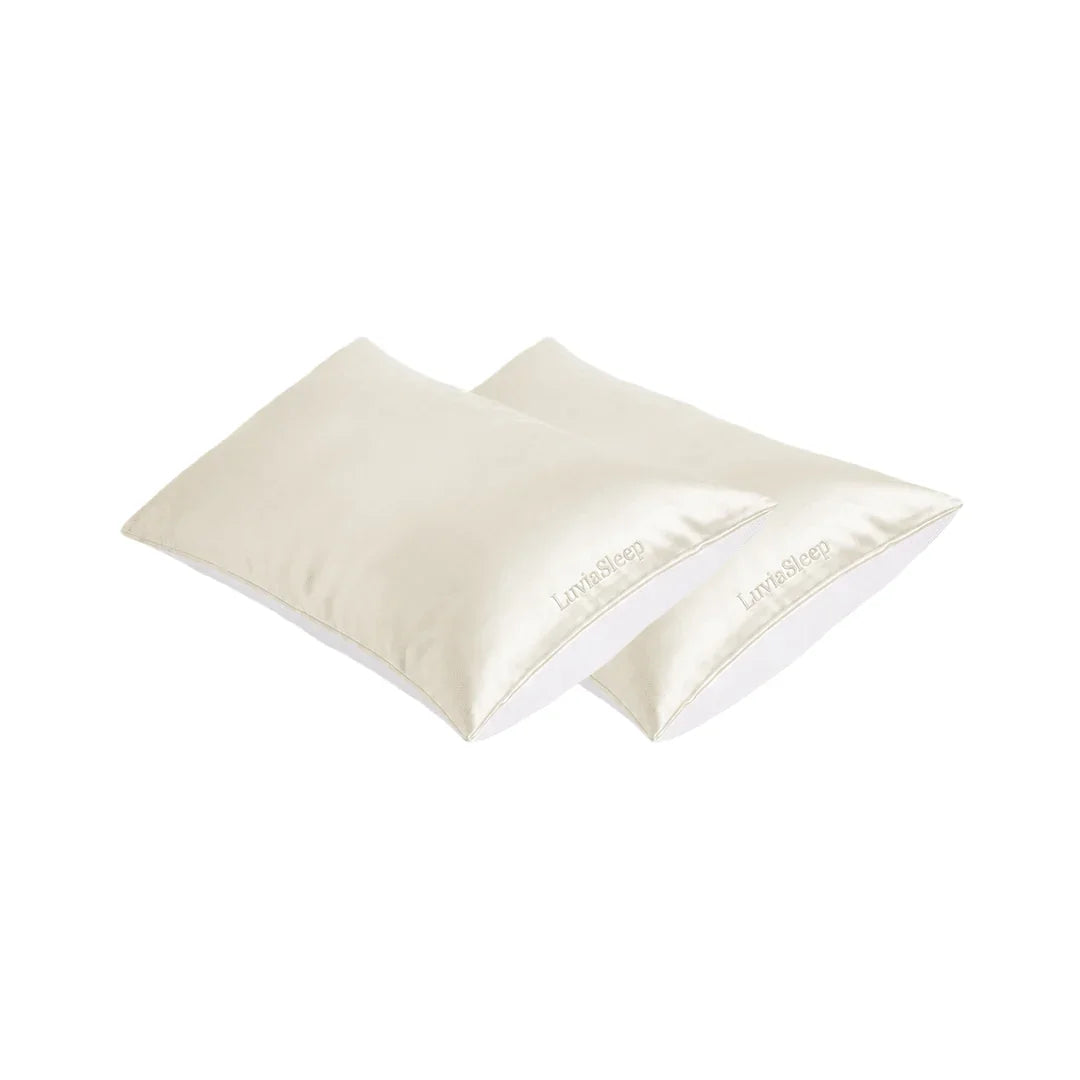 Pair of cream-colored 25-momme mulberry silk pillowcases for hair and skin care.