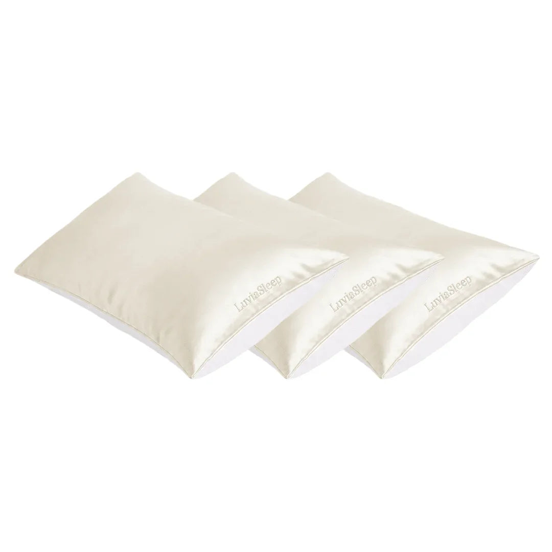 Three cream-colored 25-momme mulberry silk pillowcases for hair and skin care.