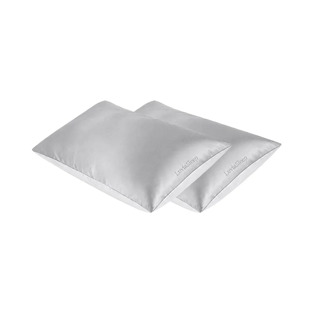 Two silver 25-momme mulberry silk pillowcases by LuviaSleep on a white background.